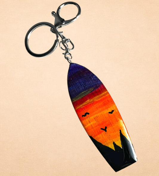 Llavero surf atardecer · Vuelo